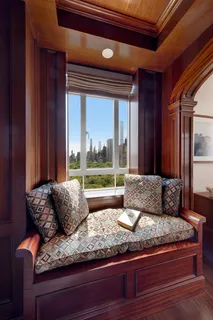 a living room with couch and a large window