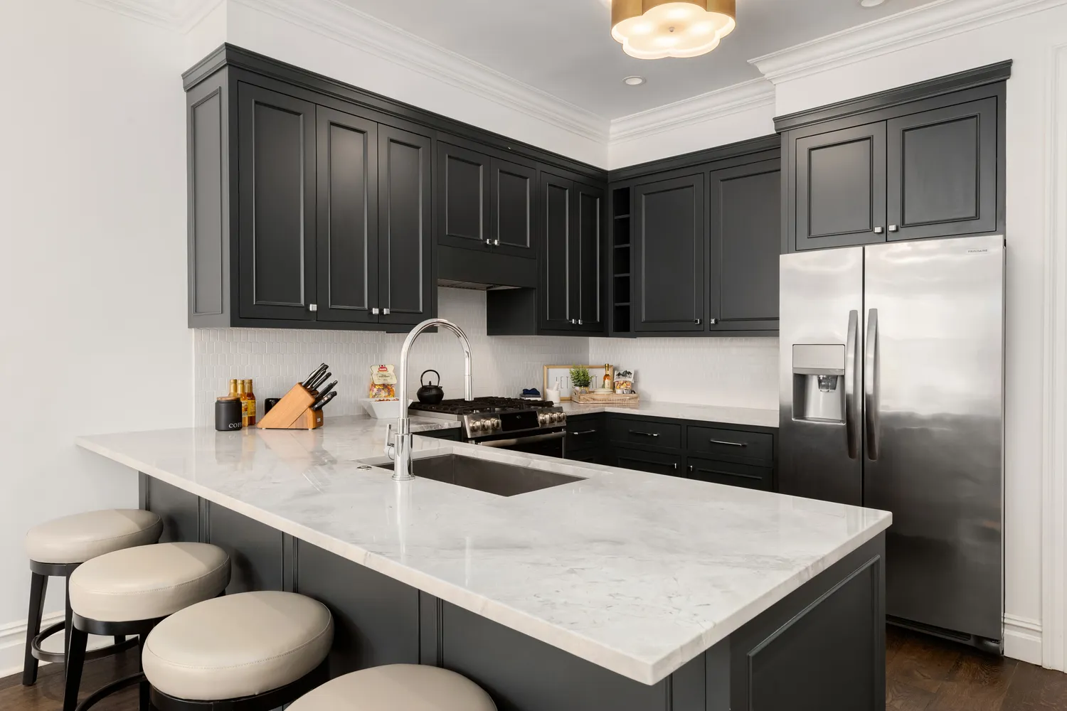 a kitchen with a sink a stove and refrigerator