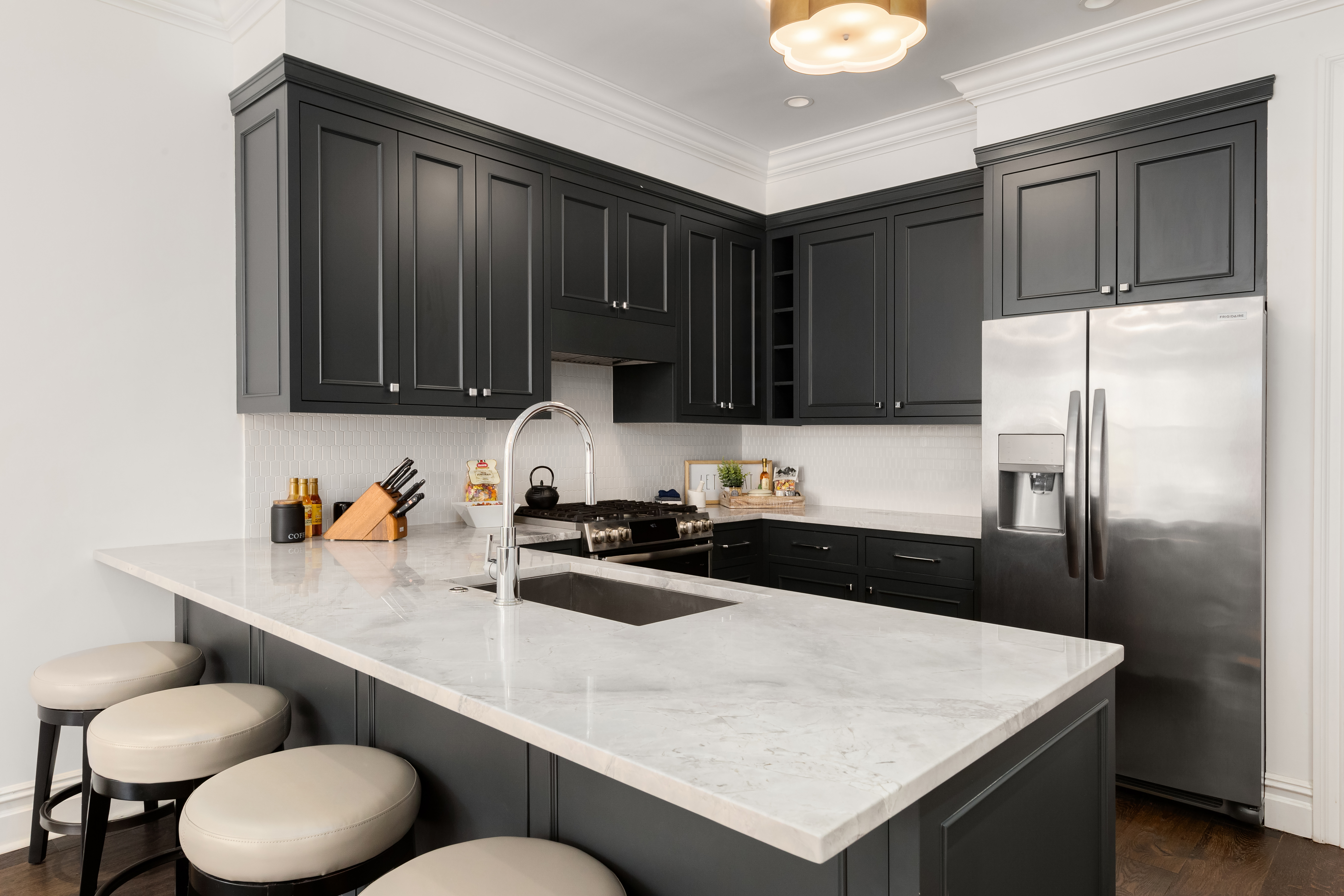 110 West 81st Street Manhattan, NY 10024 - Photo 22 of 30 a kitchen with a sink a stove and refrigerator