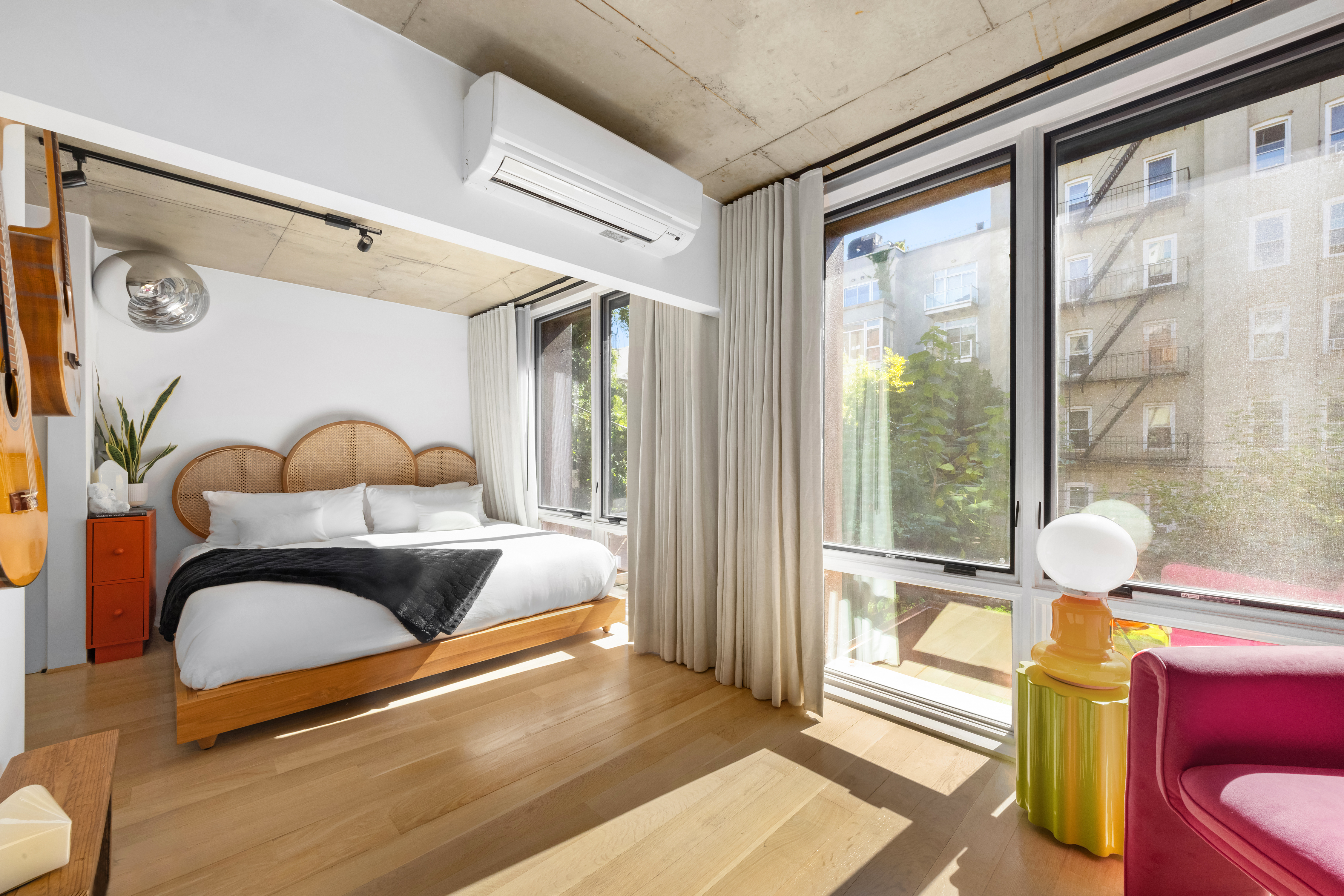 126 South 2nd Street, Unit GARDEN Brooklyn, NY 11249 - Photo 13 of 30 a bedroom with furniture and a window