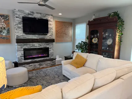 a living room with furniture and a flat screen tv