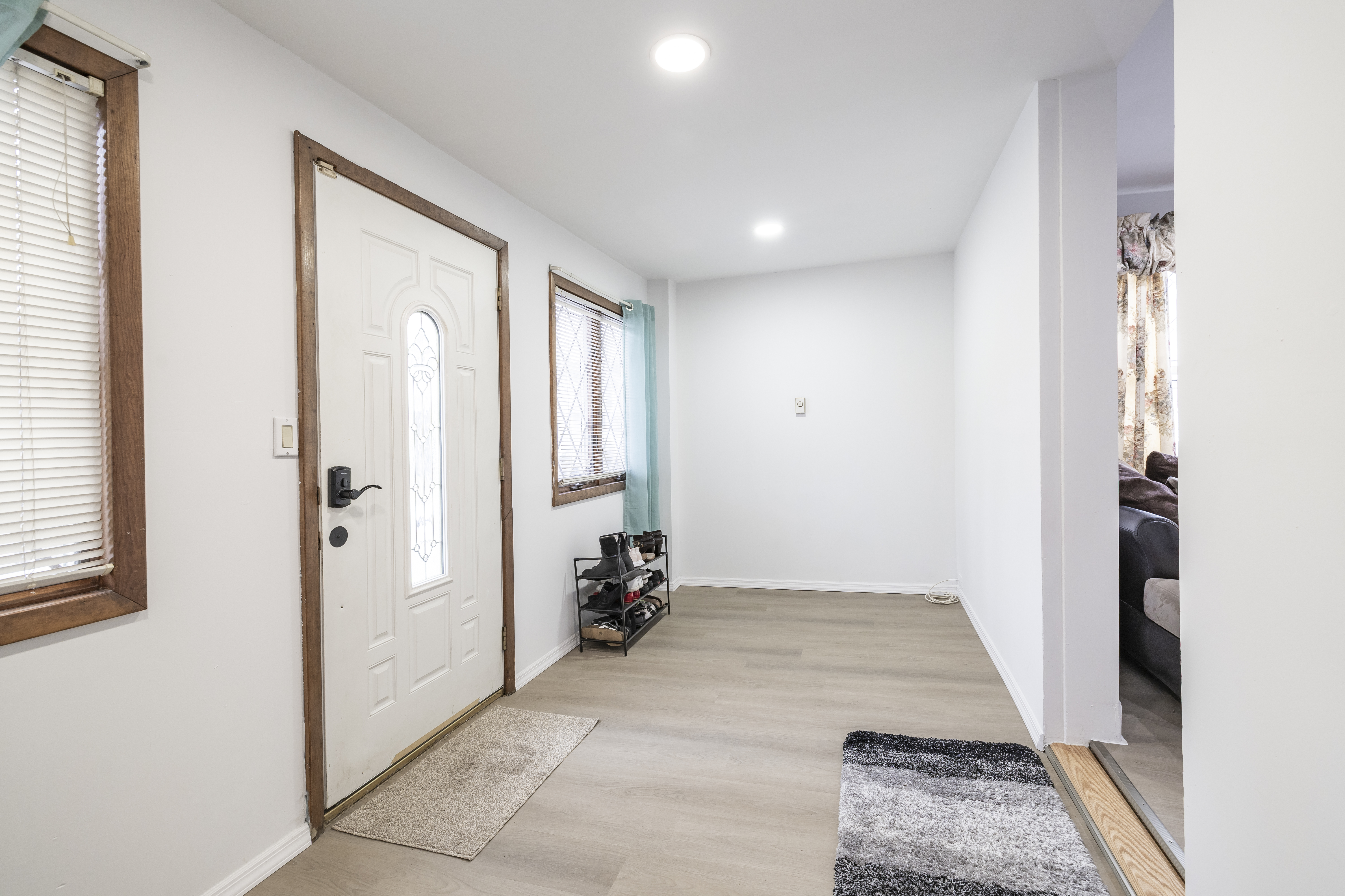 87-46 89th Street Queens, NY 11421 - Photo 2 of 25 an entryway of a house and interior space