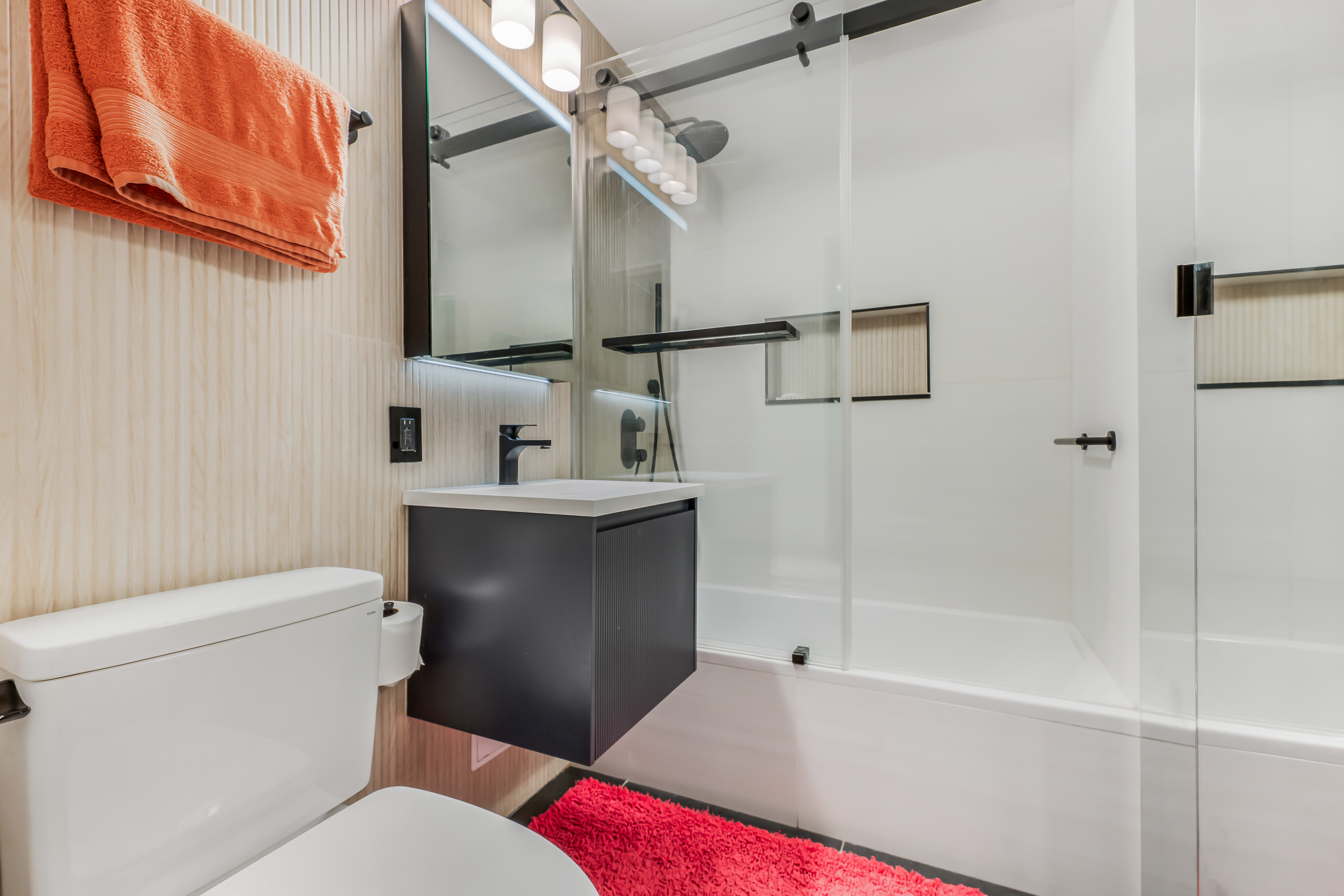 520 East 76th Street, Unit 10H Manhattan, NY 10021 - Photo 10 of 20 a bathroom with a toilet sink and shower