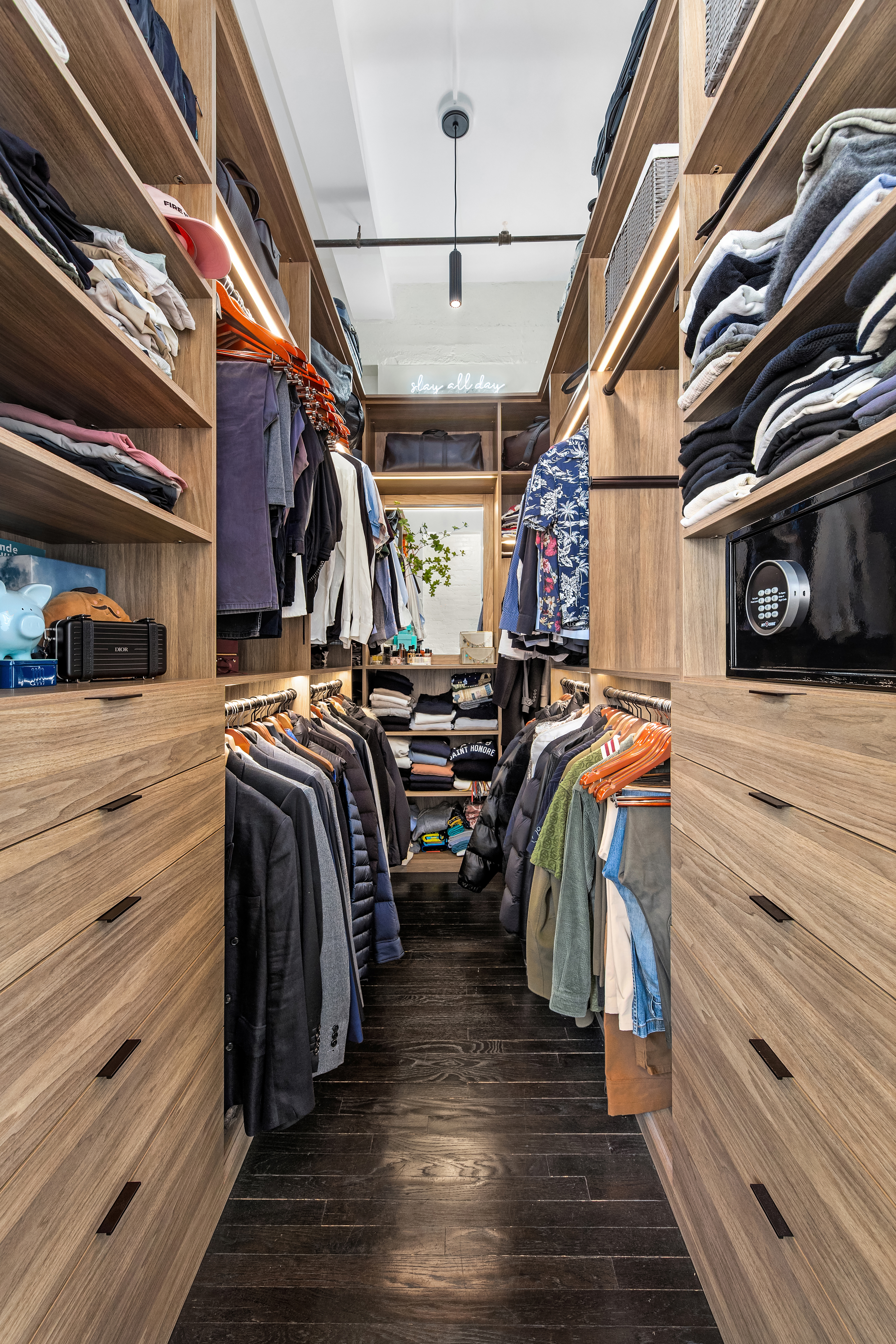 448 West 37th Street, Unit 11G/12G Manhattan, NY 10018 - Photo 11 of 17 a view of walk in closet with clothes and shoes