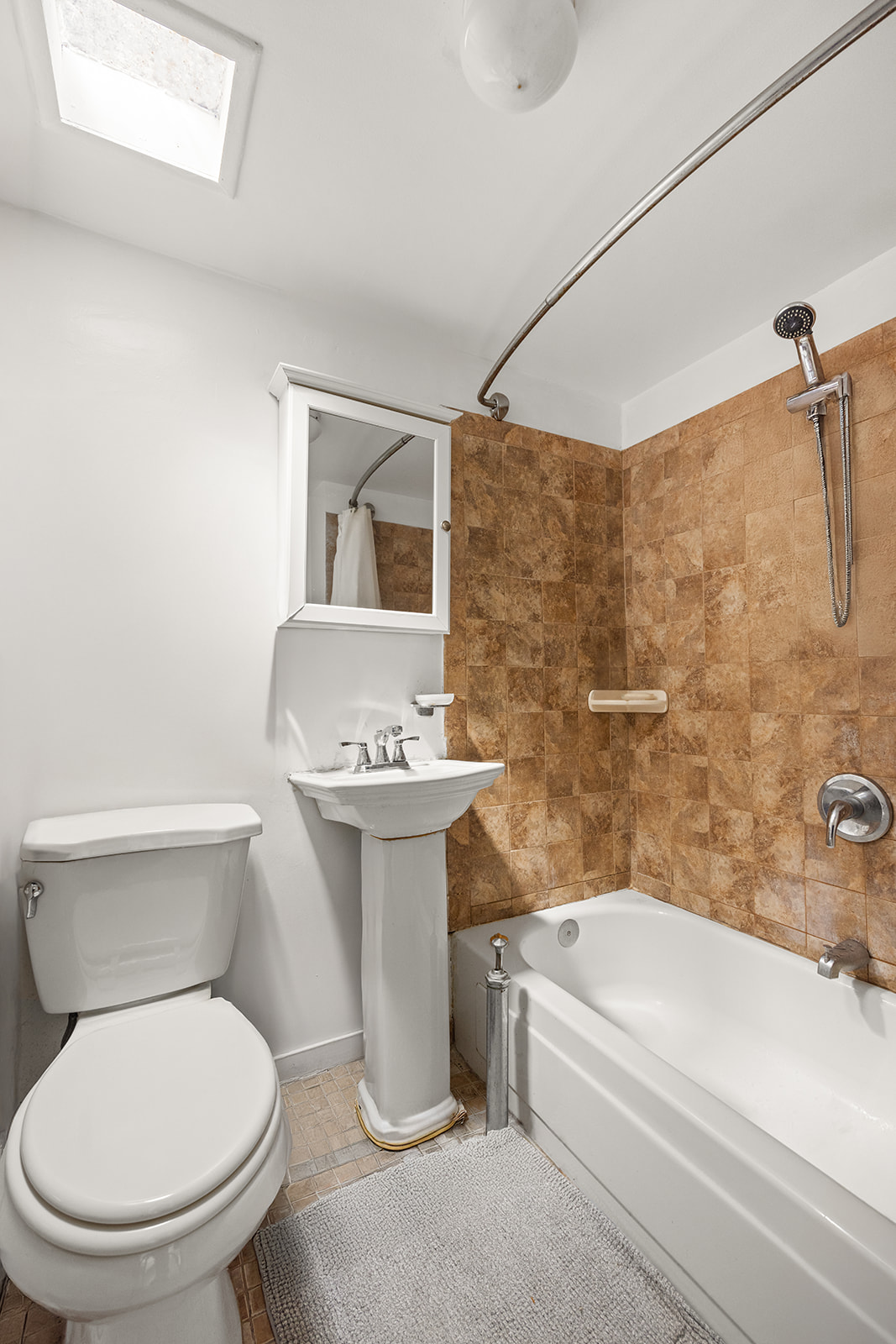 33 Park Place Brooklyn, NY 11217 - Photo 16 of 18 a white toilet sitting next to a bath tub