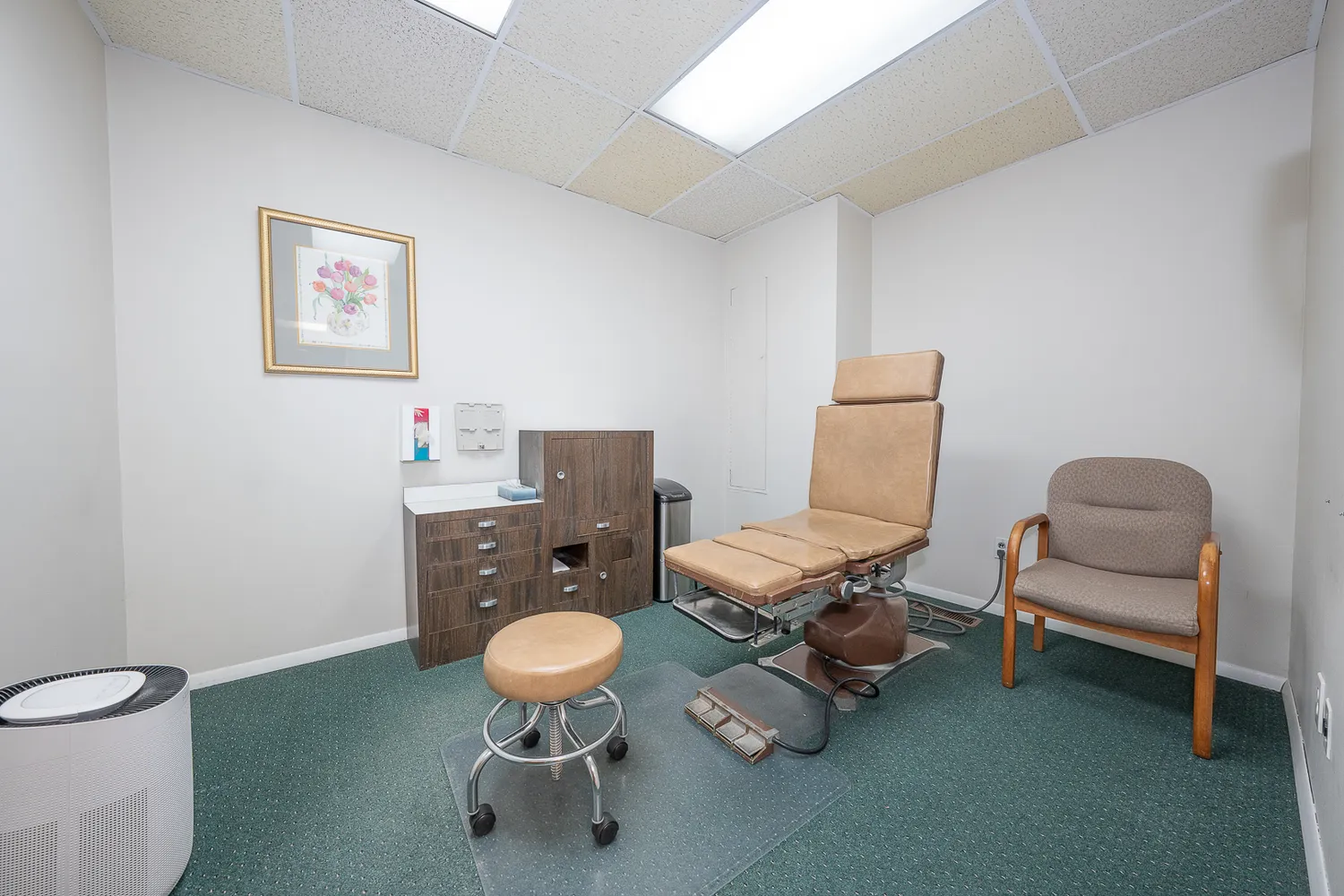 a living room with furniture and a chair