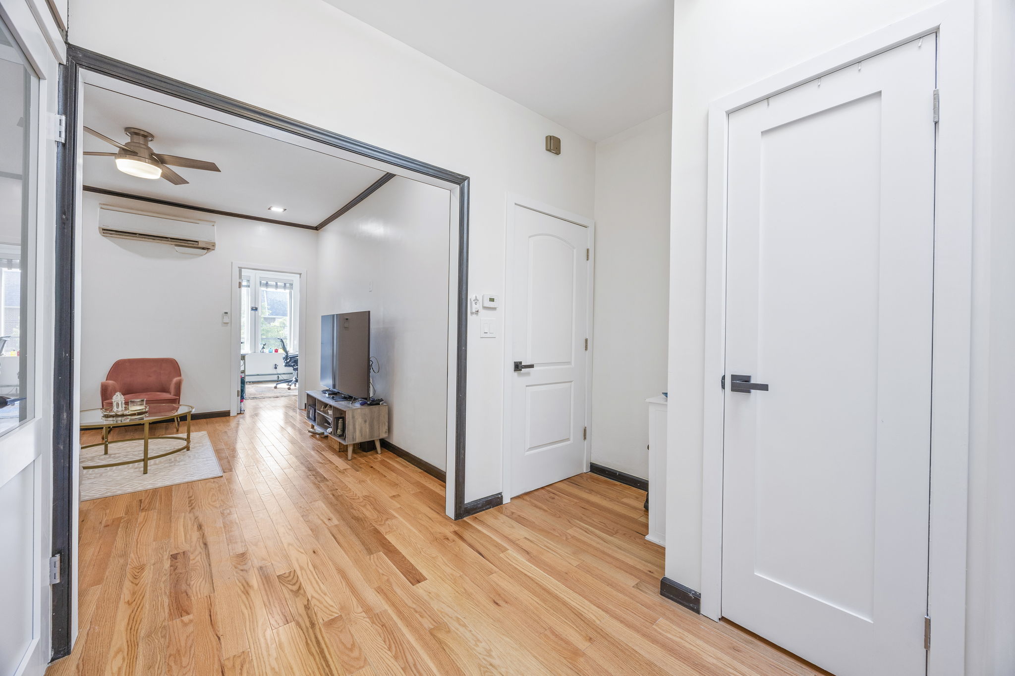 25-69 46th Street Queens, NY 11103 - Photo 4 of 33 a area with wooden floor and furniture