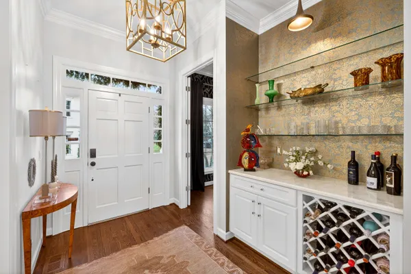 a kitchen with stainless steel appliances a stove a sink and a refrigerator