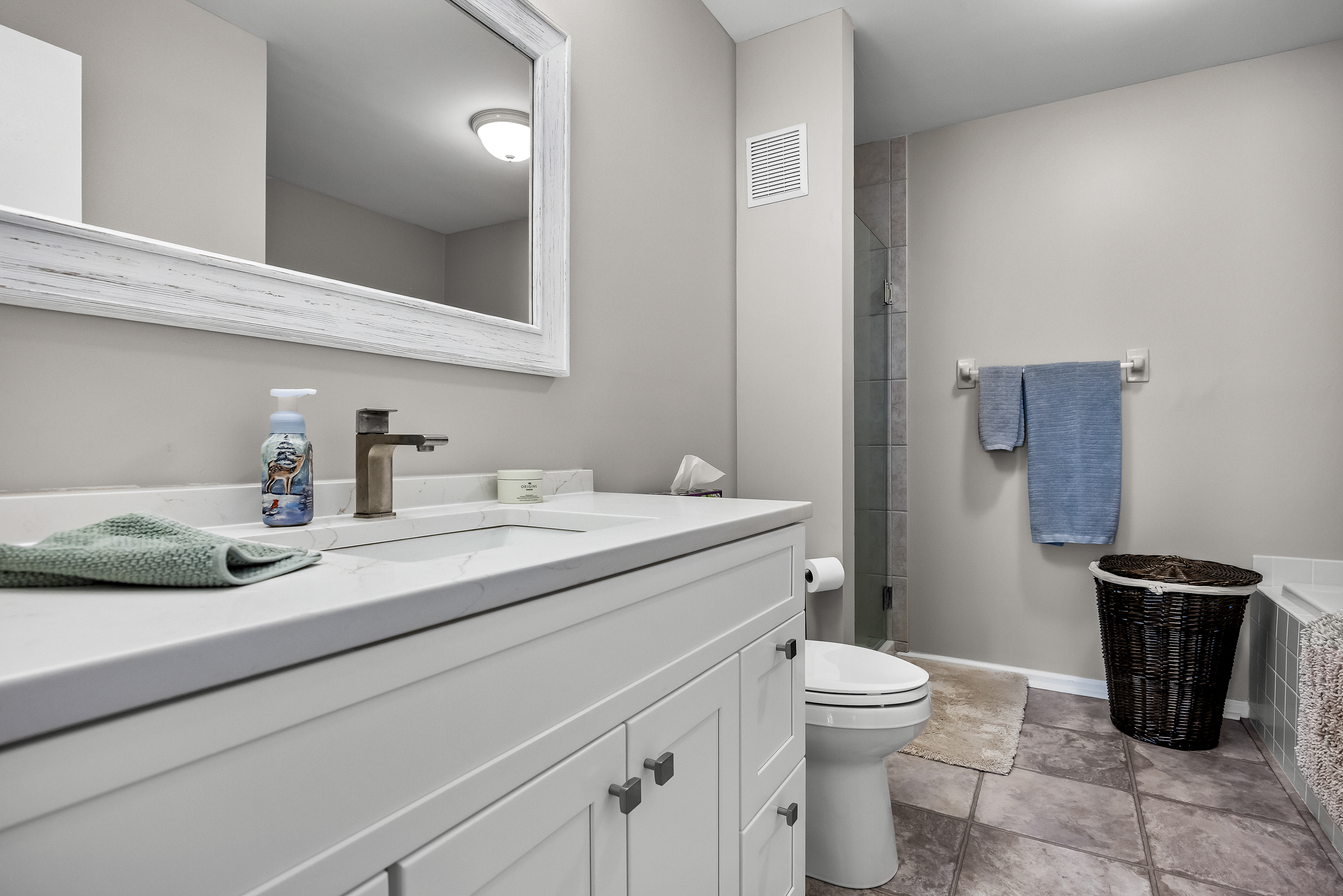 1007 A Yarmouth Lane Mount Laurel, NJ 08054 - Photo 21 of 27 a bathroom with a granite countertop sink a toilet and a mirror