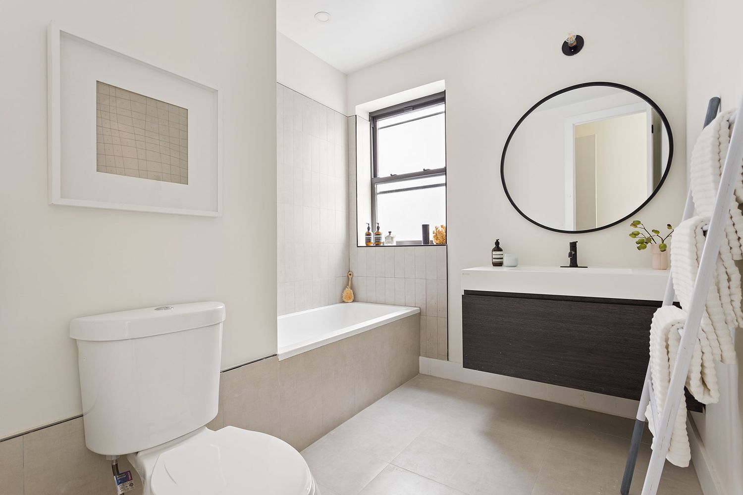 917 Saint Marks Avenue, Unit 3 Brooklyn, NY 11213 - Photo 8 of 12 a bathroom with a toilet a sink and a mirror