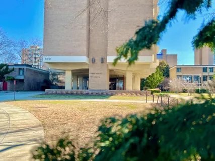 a front view of a building with a street