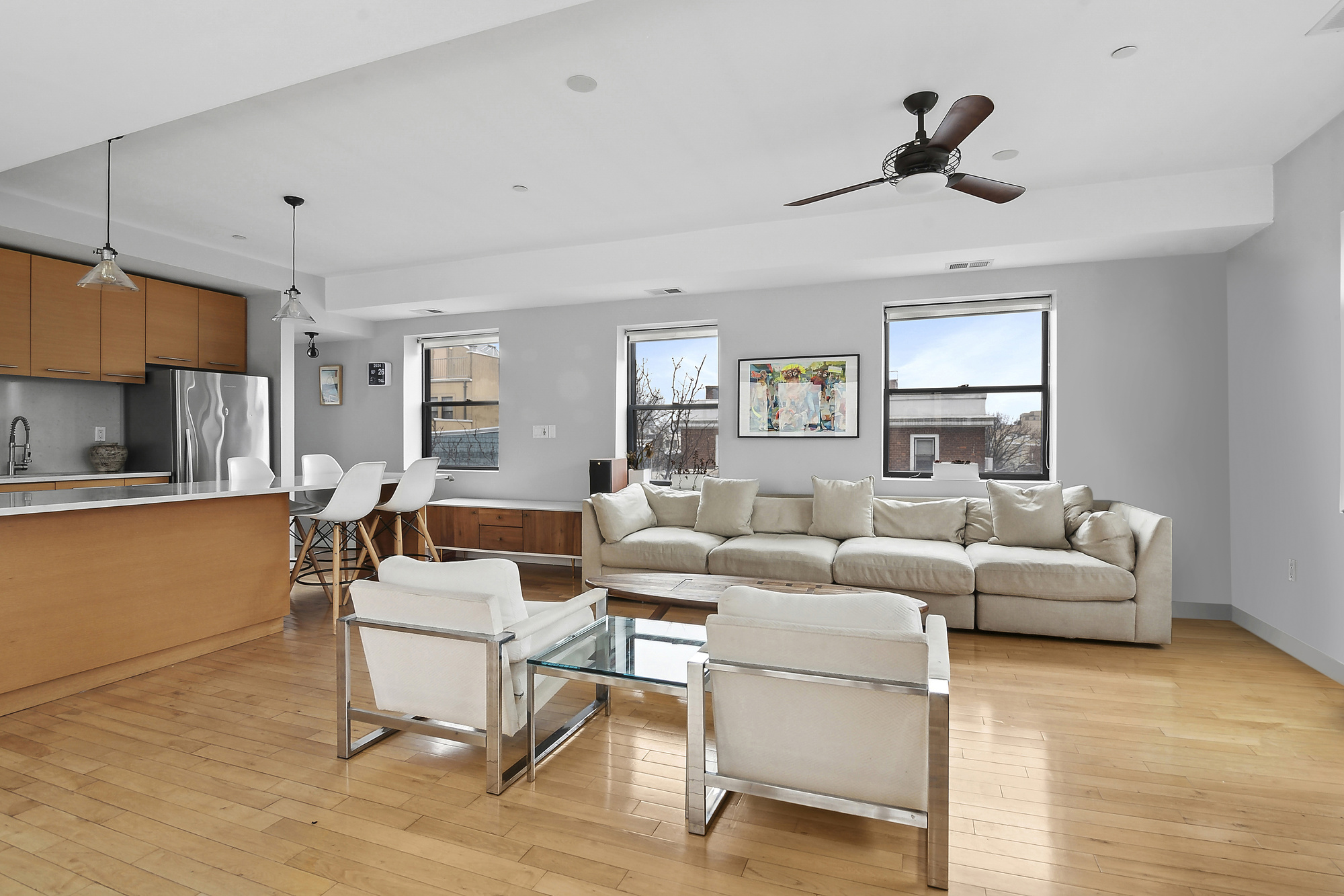 364 Manhattan Avenue, Unit 4G Brooklyn, NY 11211 - Photo 3 of 13 a living room with furniture and a large window