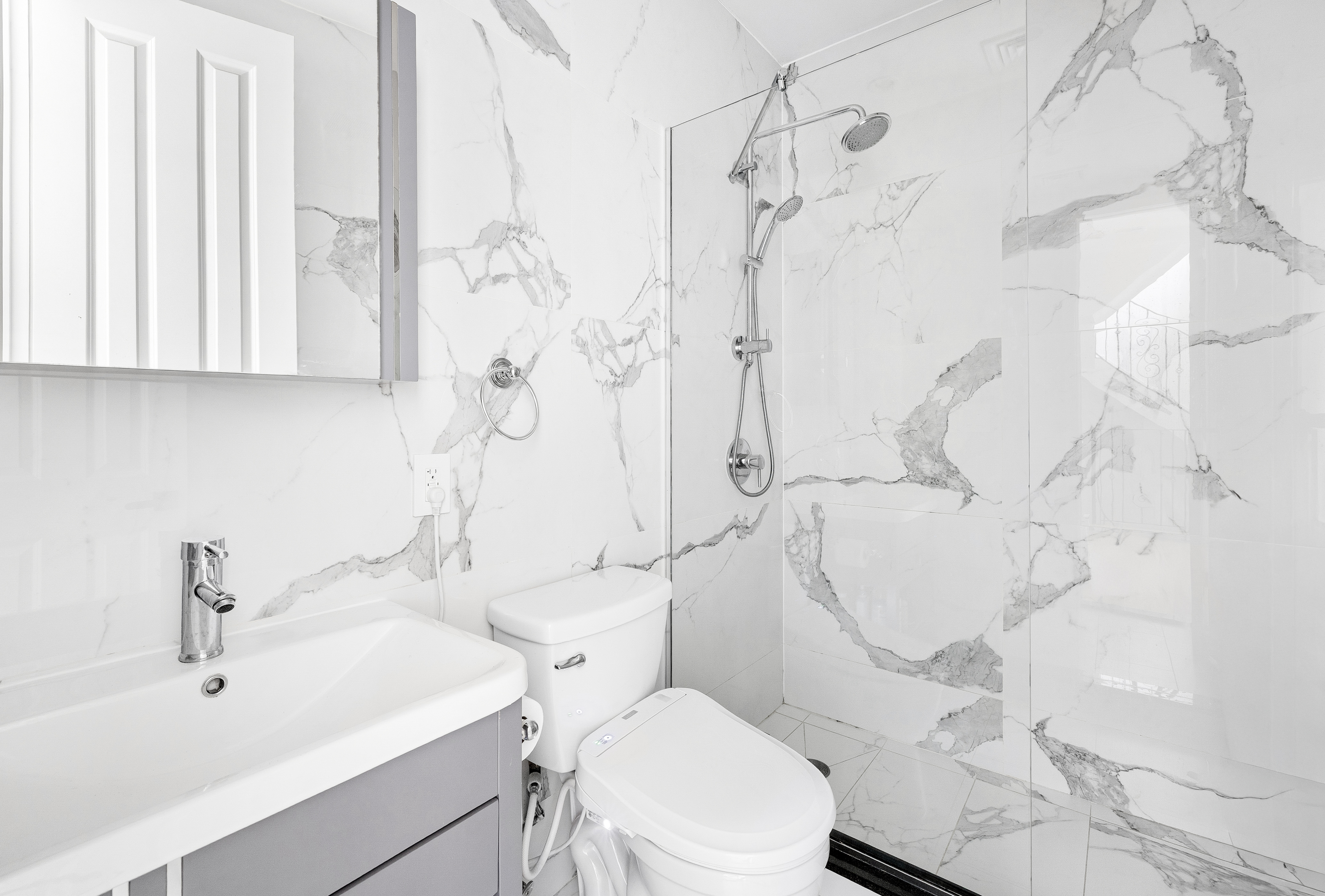 278 Nassau Avenue, Unit 2B Brooklyn, NY 11222 - Photo 6 of 18 a white toilet sitting next to a bathroom sink