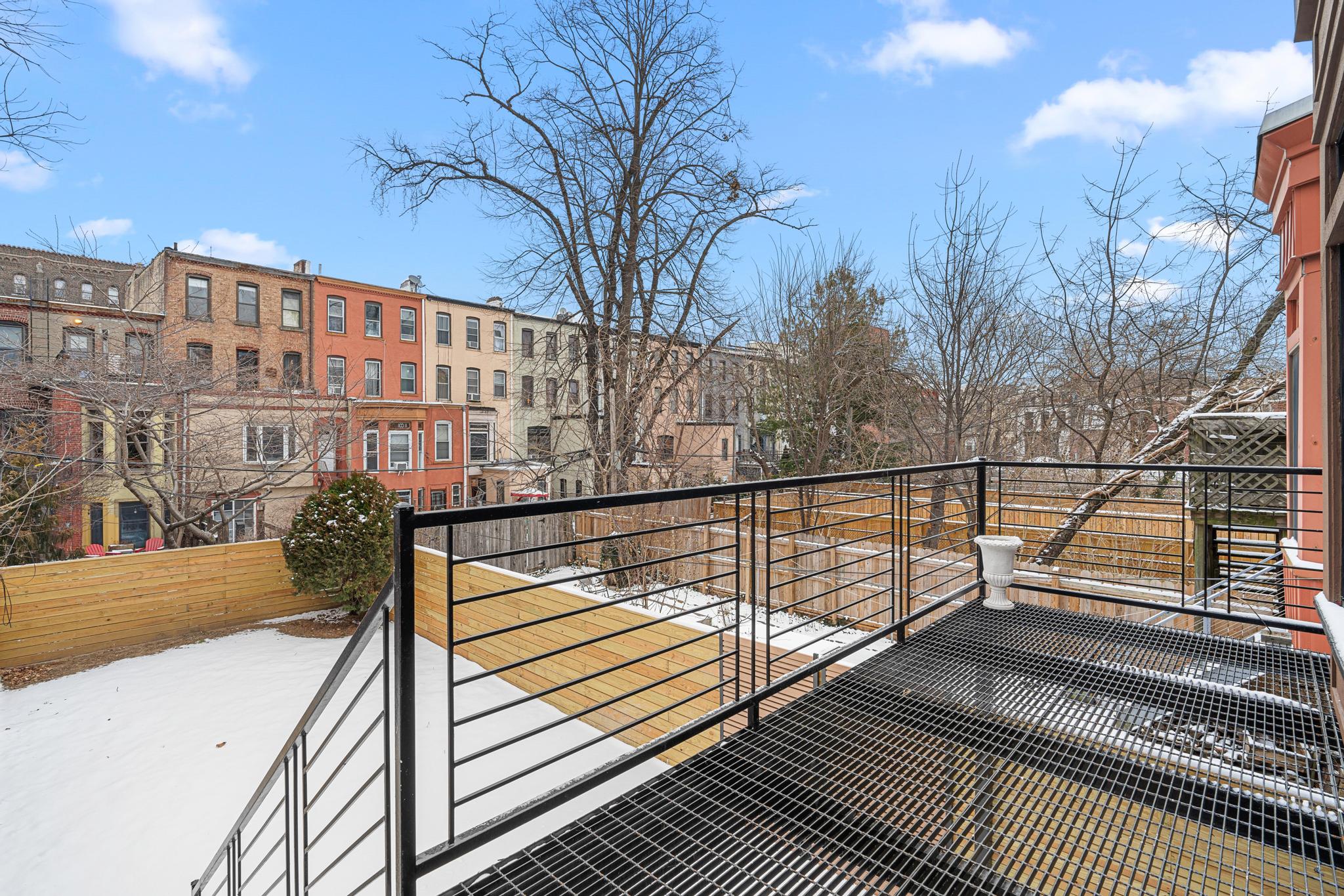 987 Sterling Place Brooklyn, NY 11213 - Photo 12 of 16 a view of balcony with wooden floor and fence