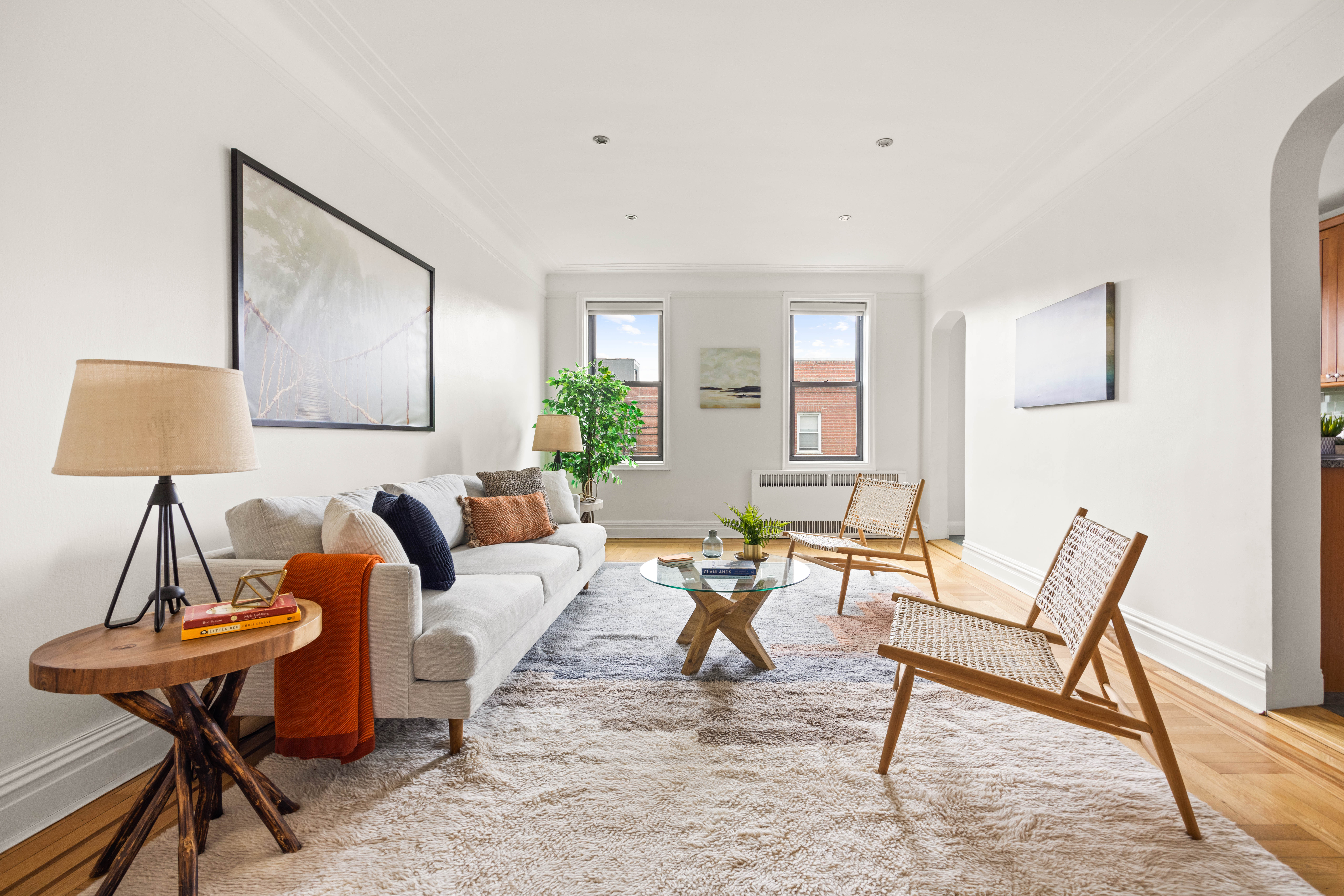 a living room with furniture and a lamp