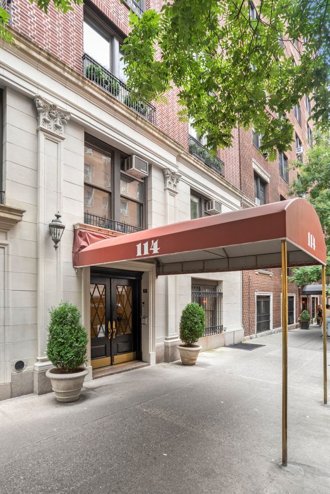 114 West 70th Street Manhattan, NY 10023 - Photo 8 of 9 front view of a building with a street