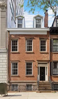 a front view of a building with a parking space