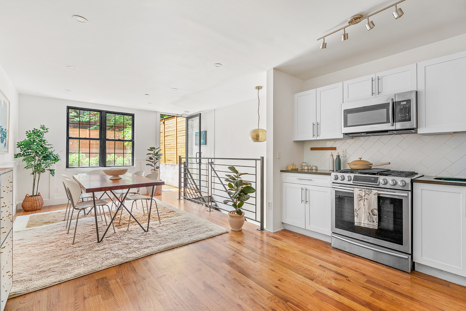 120 Pulaski Street, Unit 1B Brooklyn, NY 11206 - Photo 4 of 13 a view of a kitchen with microwave and furniture