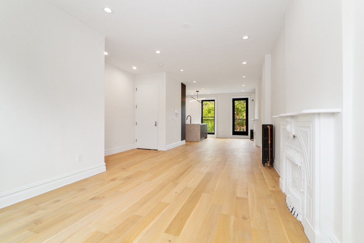 354 Macon Street, Unit 2 Brooklyn, NY 11233 - Photo 3 of 13 a view of livingroom with kitchen and the view