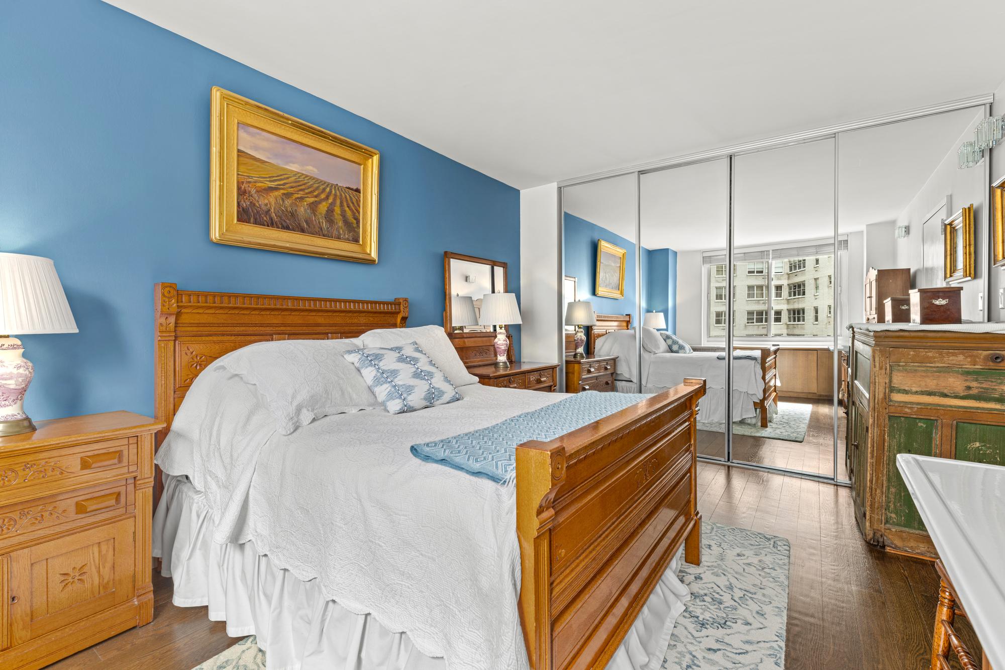 2025 Broadway, Unit 5K Manhattan, NY 10023 - Photo 4 of 15 a bed room with a bed and a dresser