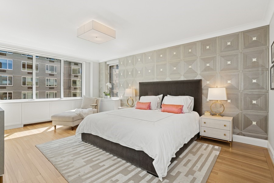 350 East 57th Street, Unit 14B Manhattan, NY 10022 - Photo 9 of 14 a bedroom with a bed and a large window