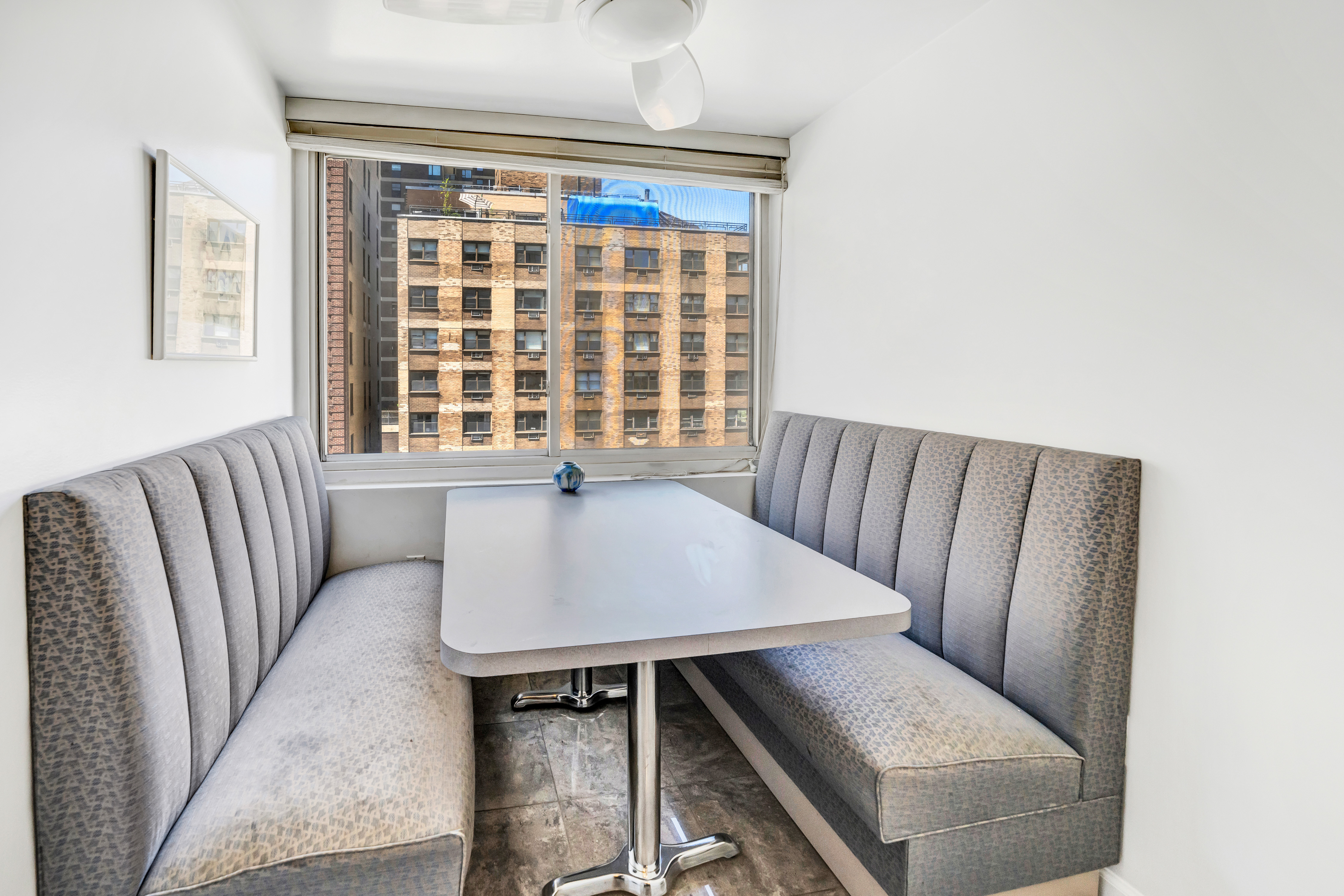 35 Sutton Place, Unit 7E Manhattan, NY 10022 - Photo 8 of 18 a living room with furniture and a window