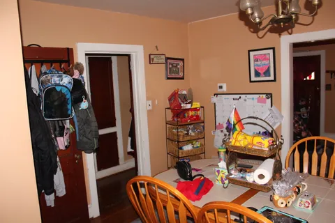 a view of a workspace with furniture and closet