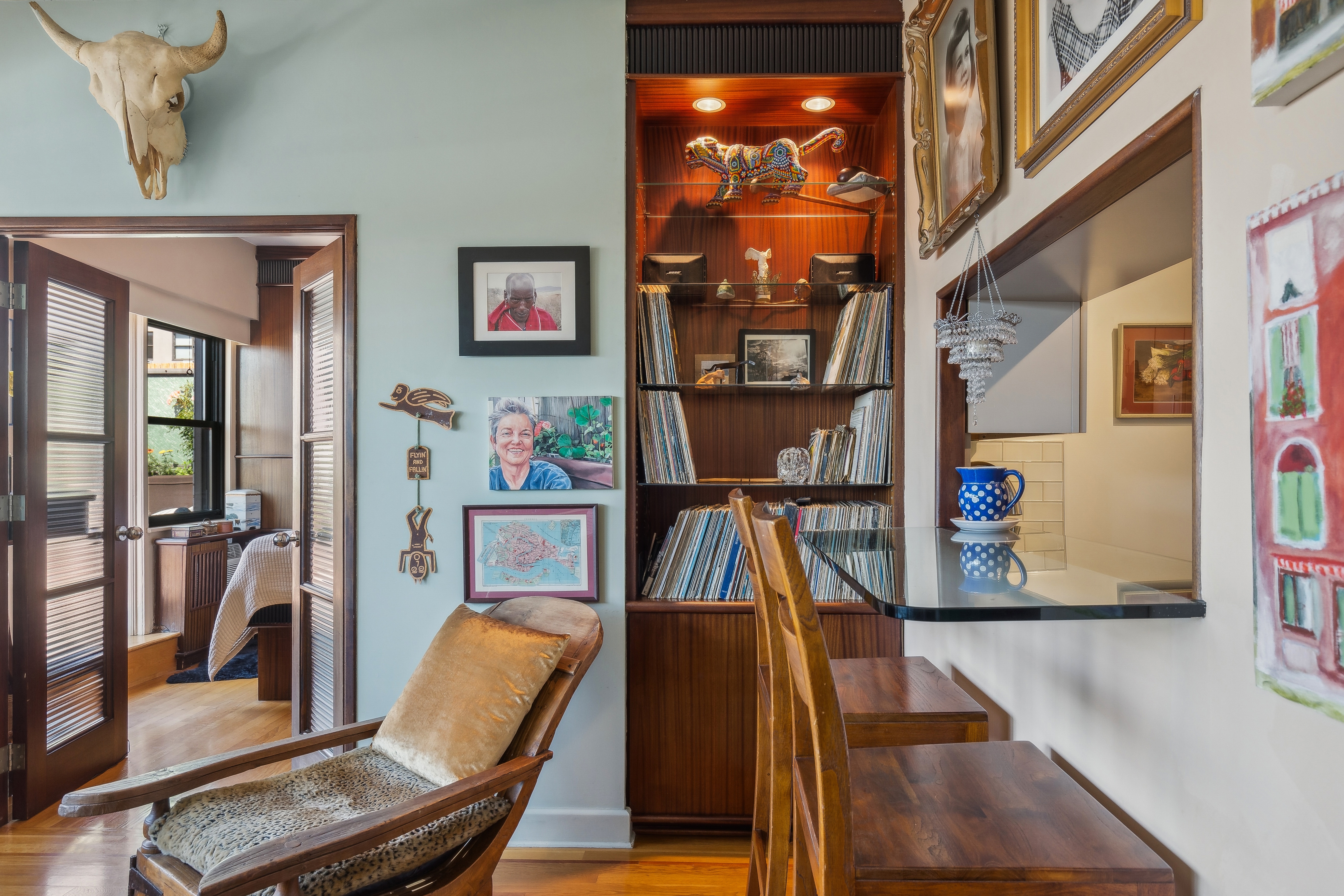 210 East 15th Street, Unit PHD Manhattan, NY 10003 - Photo 5 of 12 a living room with furniture and a floor to ceiling window