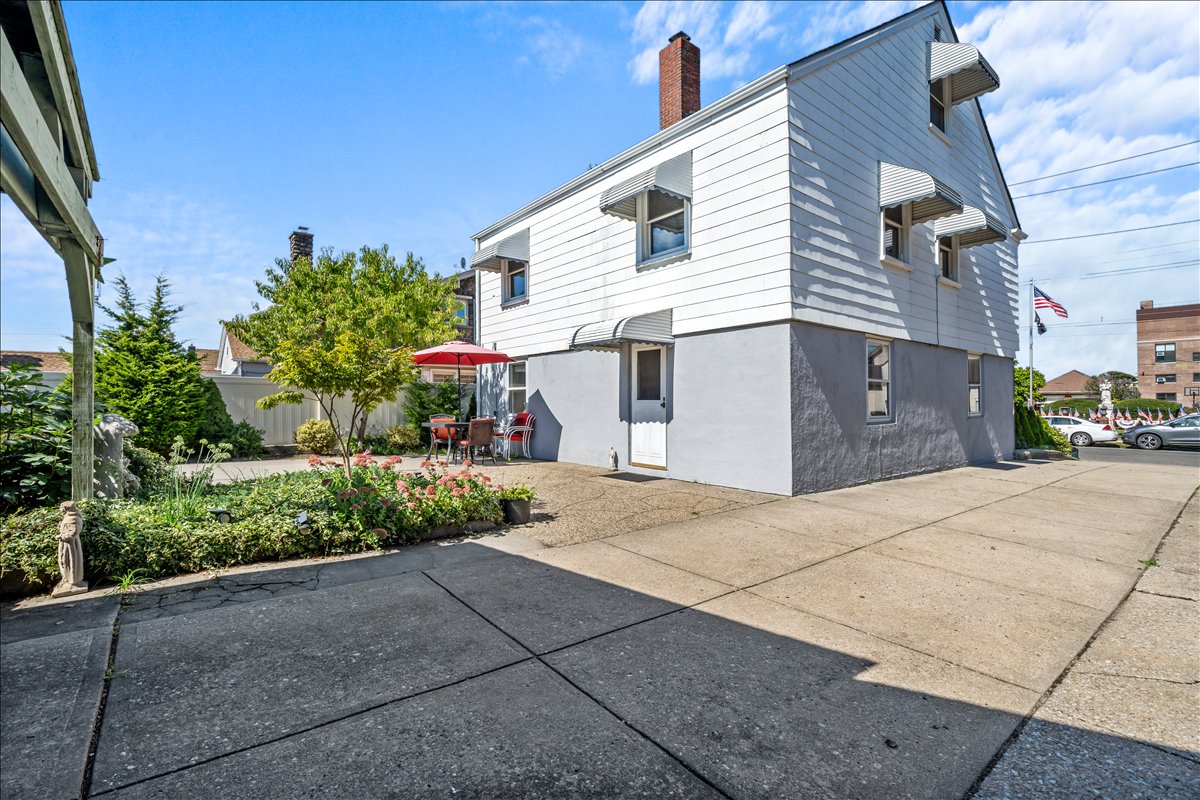 100-14 159th Avenue Queens, NY 11414 - Photo 5 of 26 a view of a house with a street