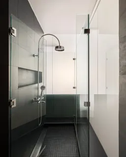 a bathroom with a sink and shower