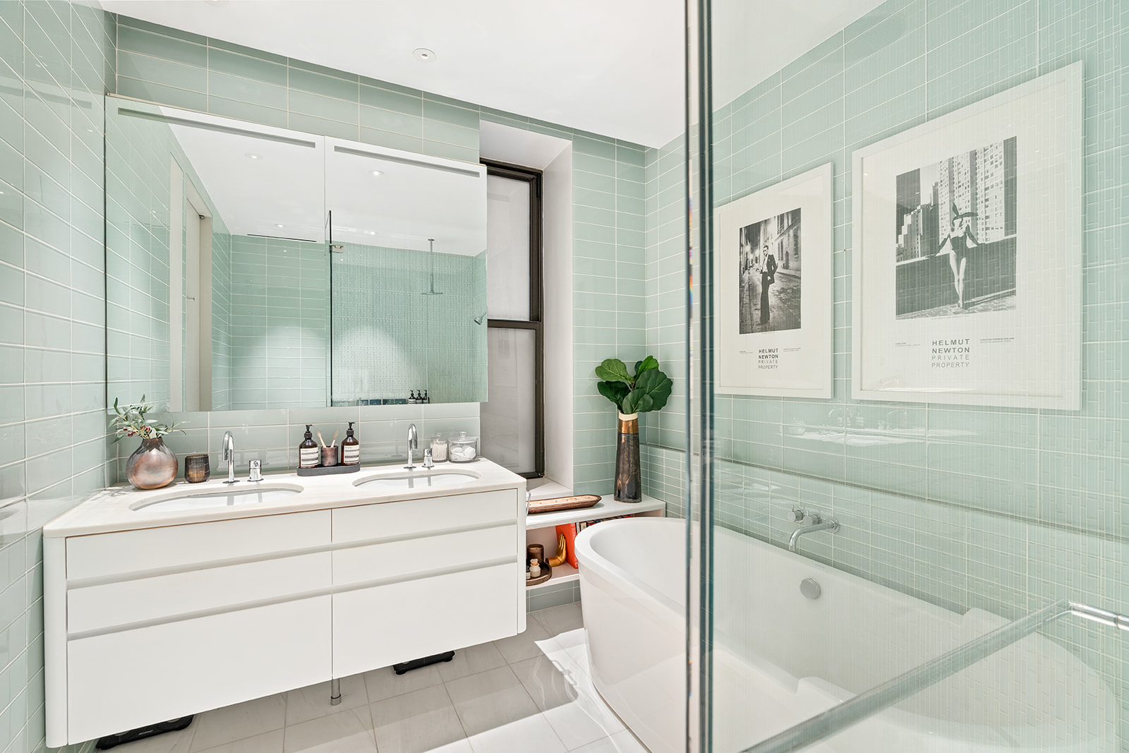 105 5th Avenue, Unit E5 Manhattan, NY 10003 - Photo 8 of 12 a bathroom with a double vanity sink mirror and bathtub