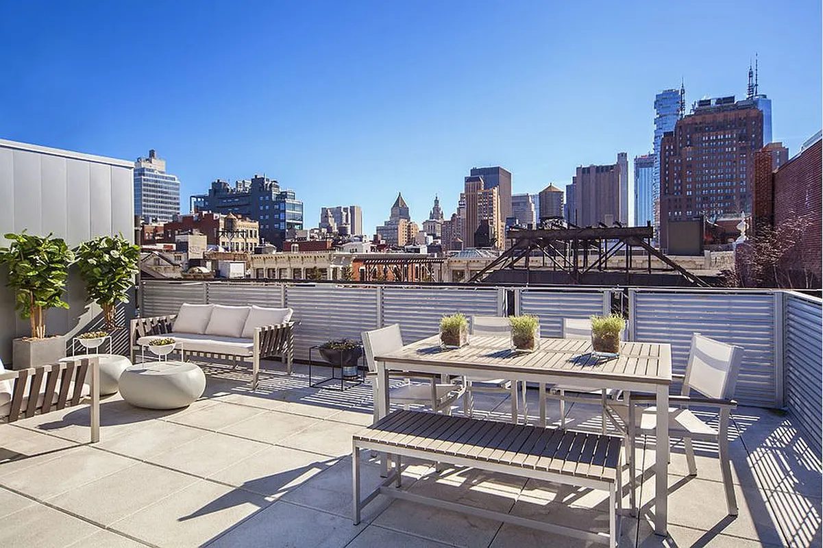 63 Greene Street, Unit PHB Manhattan, NY 10012 - Photo 5 of 17 a view of a city with tall buildings