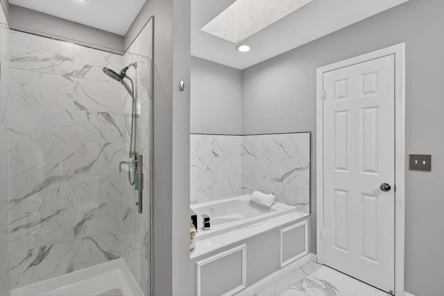 a bathroom with a granite countertop shower sink and vanity