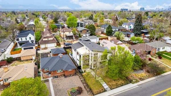 an aerial view of residential houses with outdoor space