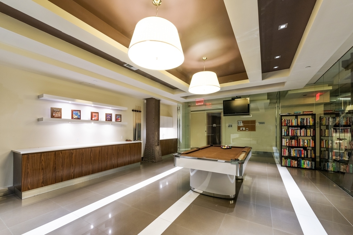 2-17 51st Avenue, Unit 606 Queens, NY 11101 - Photo 16 of 18 a lobby with furniture and window