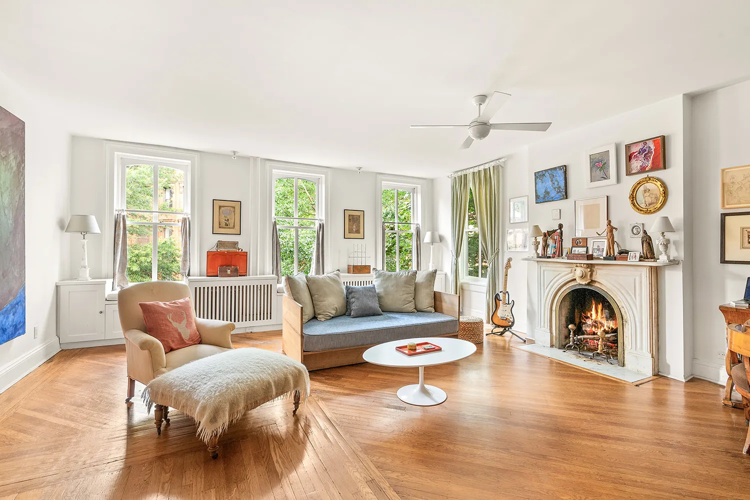 a living room with furniture and a fireplace
