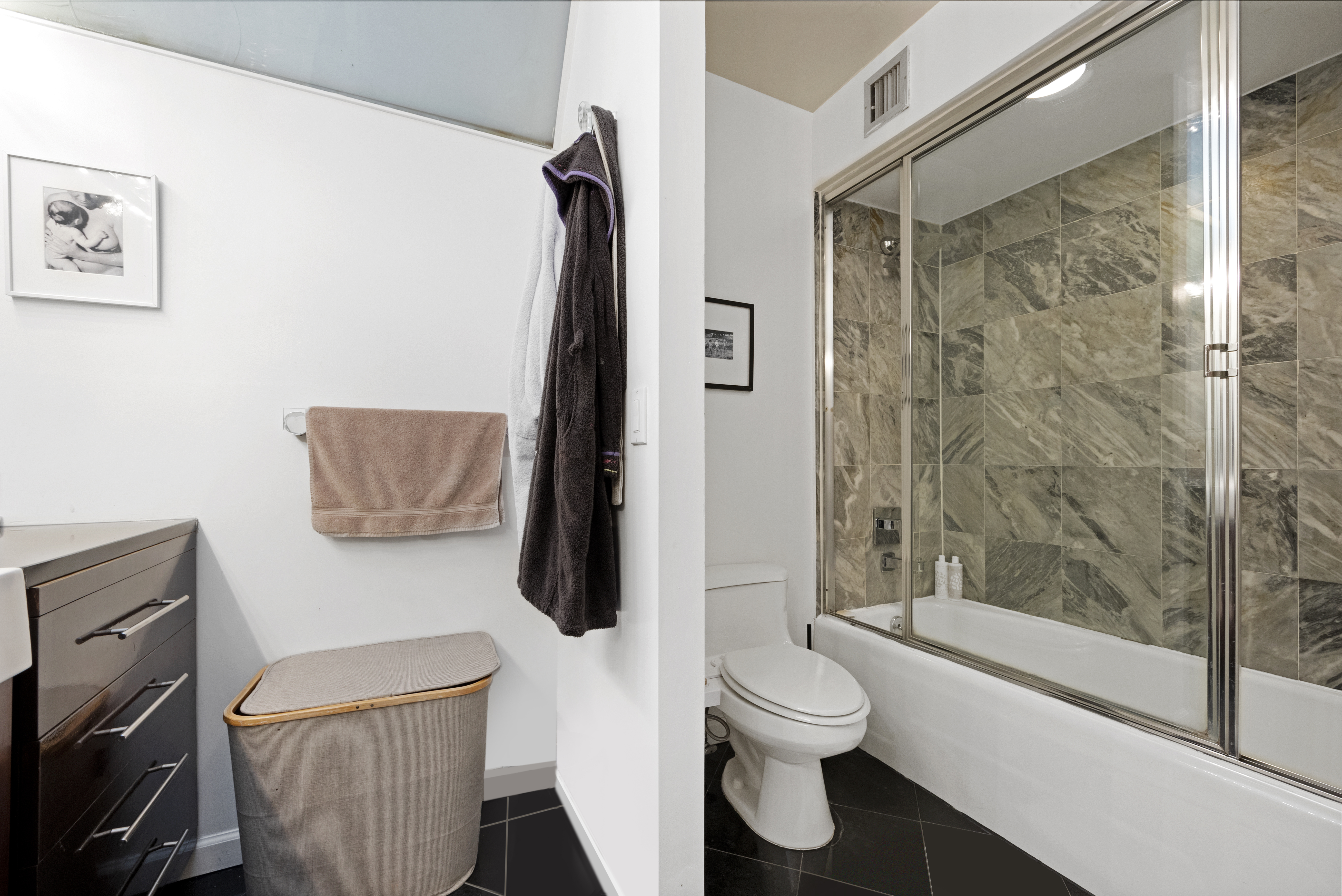 152 East 74th Street, Unit 2 Manhattan, NY 10021 - Photo 12 of 16 a bathroom with a toilet and a shower