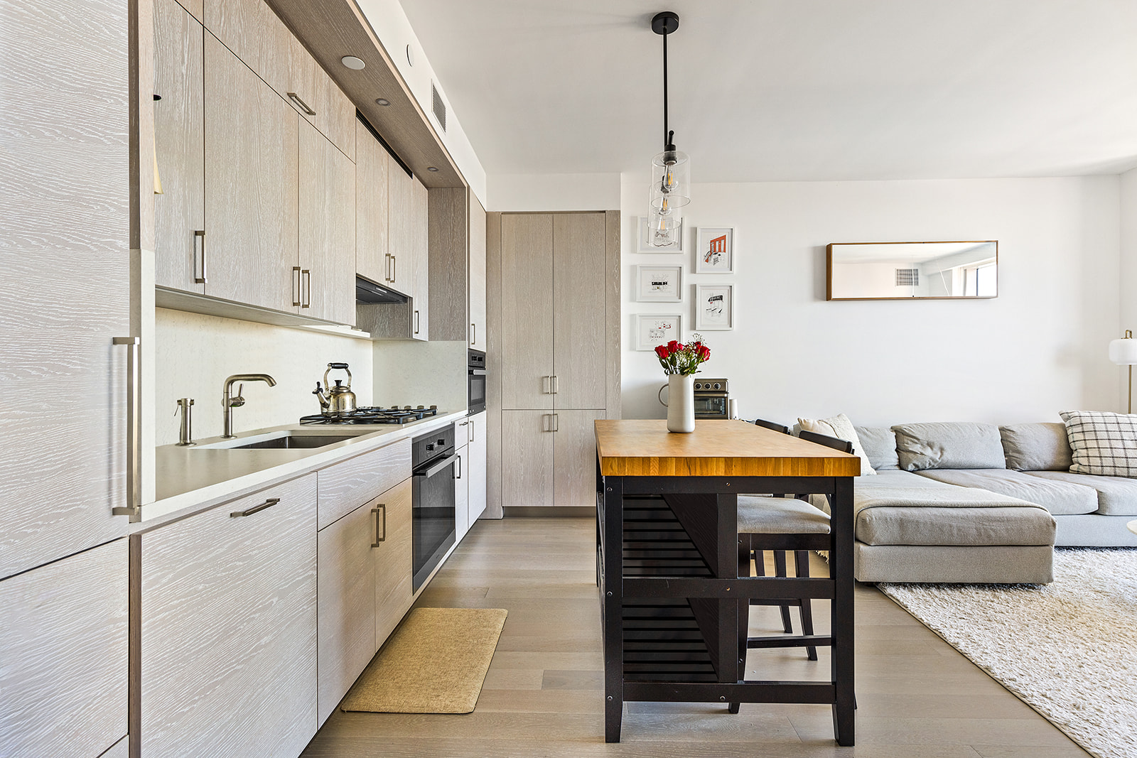 1 City Point, Unit 36D Brooklyn, NY 11201 - Photo 3 of 16 a kitchen with stainless steel appliances granite countertop a sink stove and cabinets