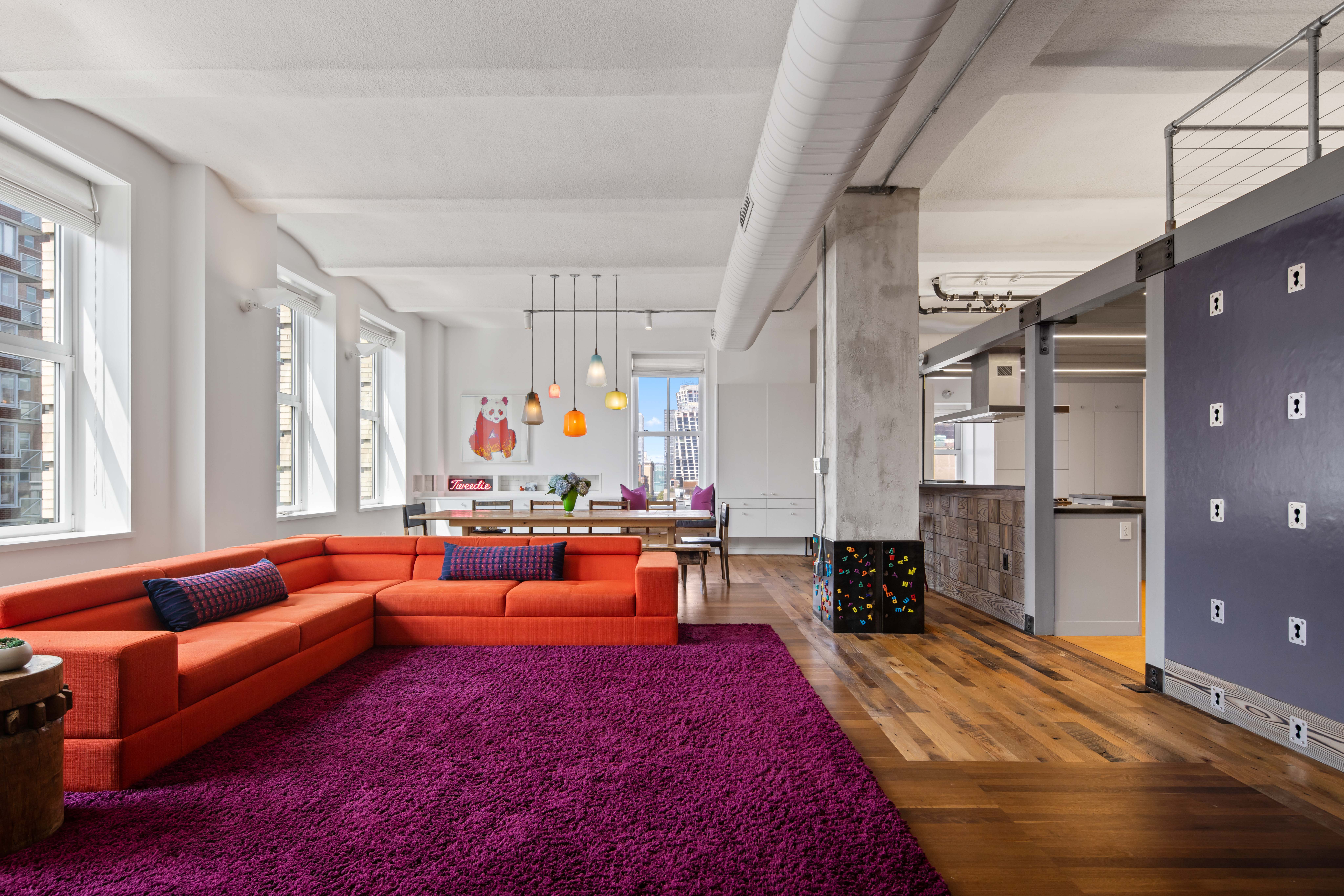 257 West 17th Street, Unit 7AB Manhattan, NY 10011 - Photo 6 of 21 a living room with furniture and a chandelier
