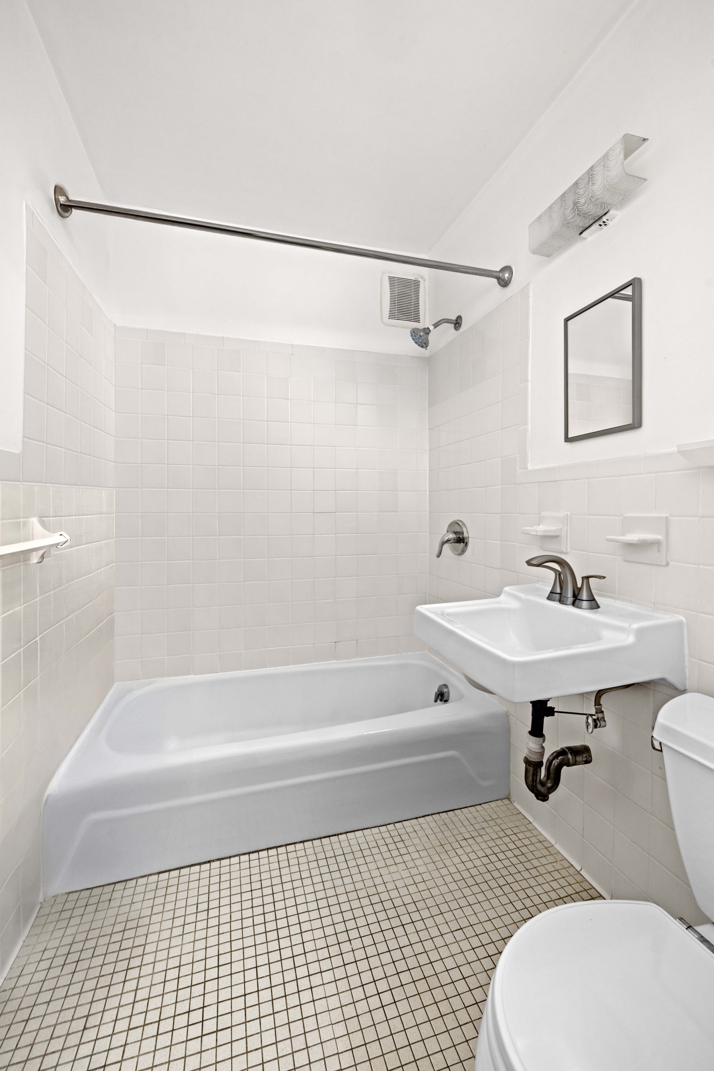 90 Gold Street, Unit 21G Manhattan, NY 10038 - Photo 5 of 9 a bathroom with a sink toilet and shower