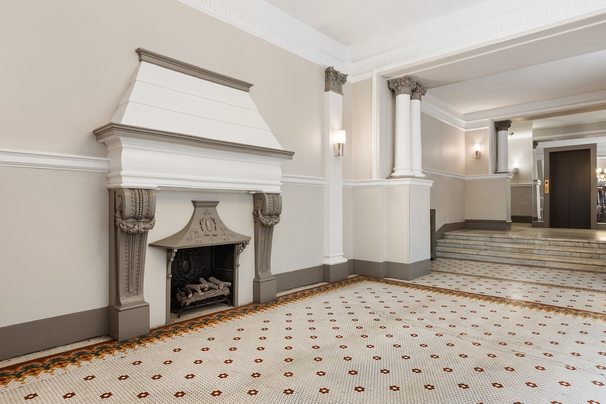 229 West 97th Street, Unit 5M New York, NY 10025 - Photo 10 of 11 a bedroom with a bed and a fireplace