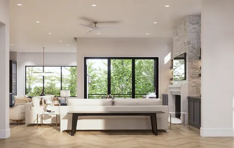 a living room with furniture a chandelier and a window