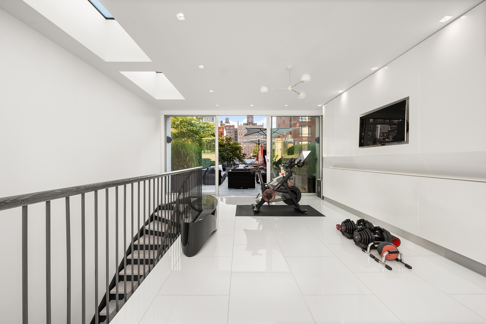 184 East 75th Street Manhattan, NY 10021 - Photo 15 of 20 a view of a living room hardwood floor and a flat screen tv