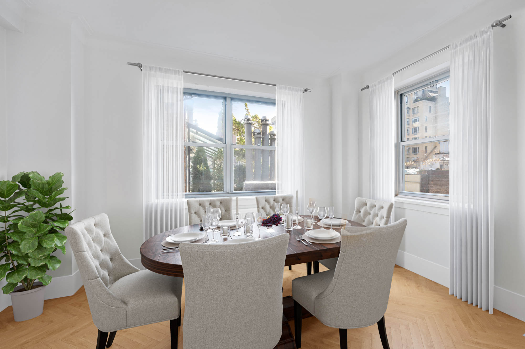 923 5th Avenue, Unit 8F Manhattan, NY 10021 - Photo 2 of 8 a view of a a dining room with furniture window and wooden floor