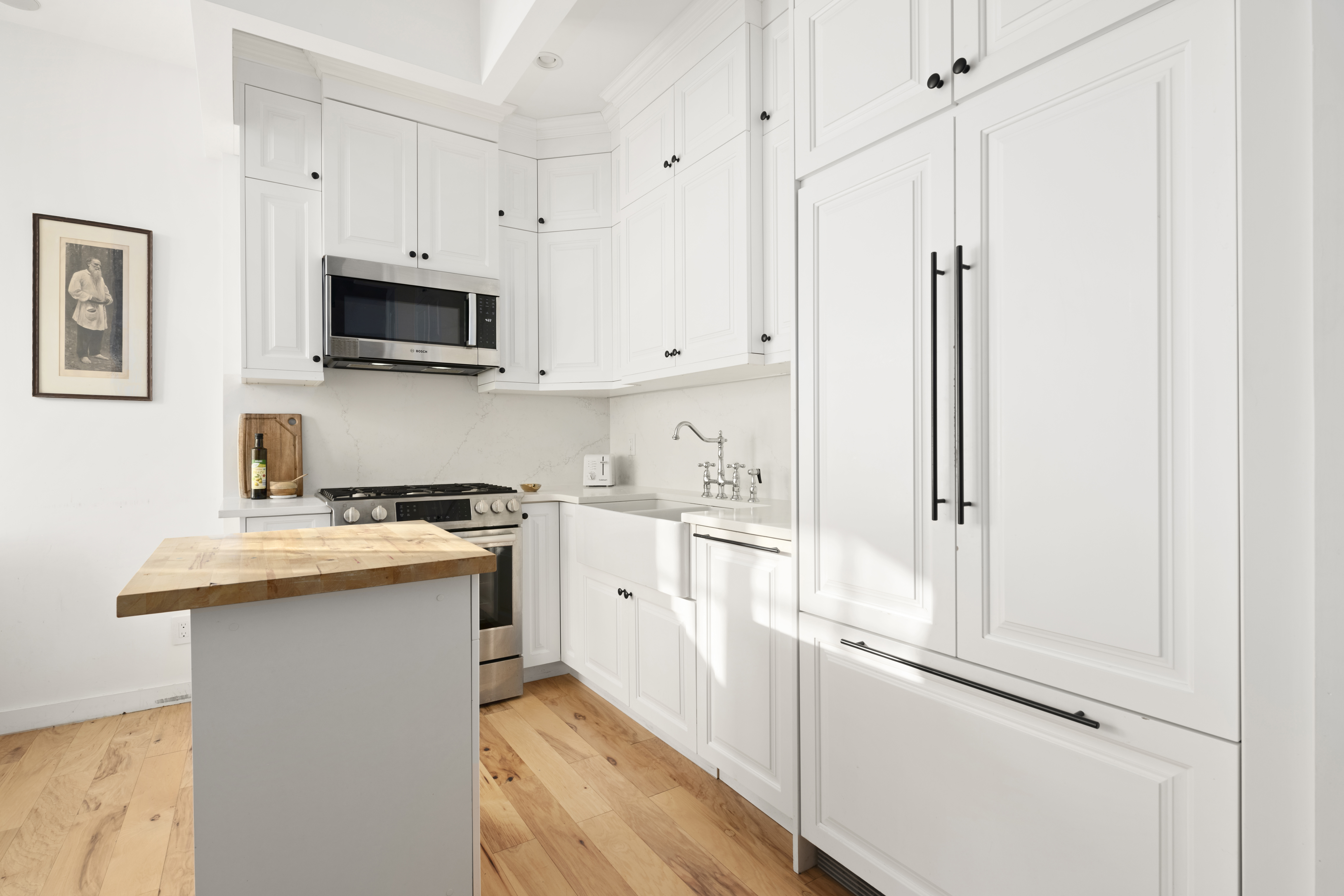 278 Nassau Avenue, Unit 3B Brooklyn, NY 11222 - Photo 3 of 12 a kitchen with white cabinets and white appliances