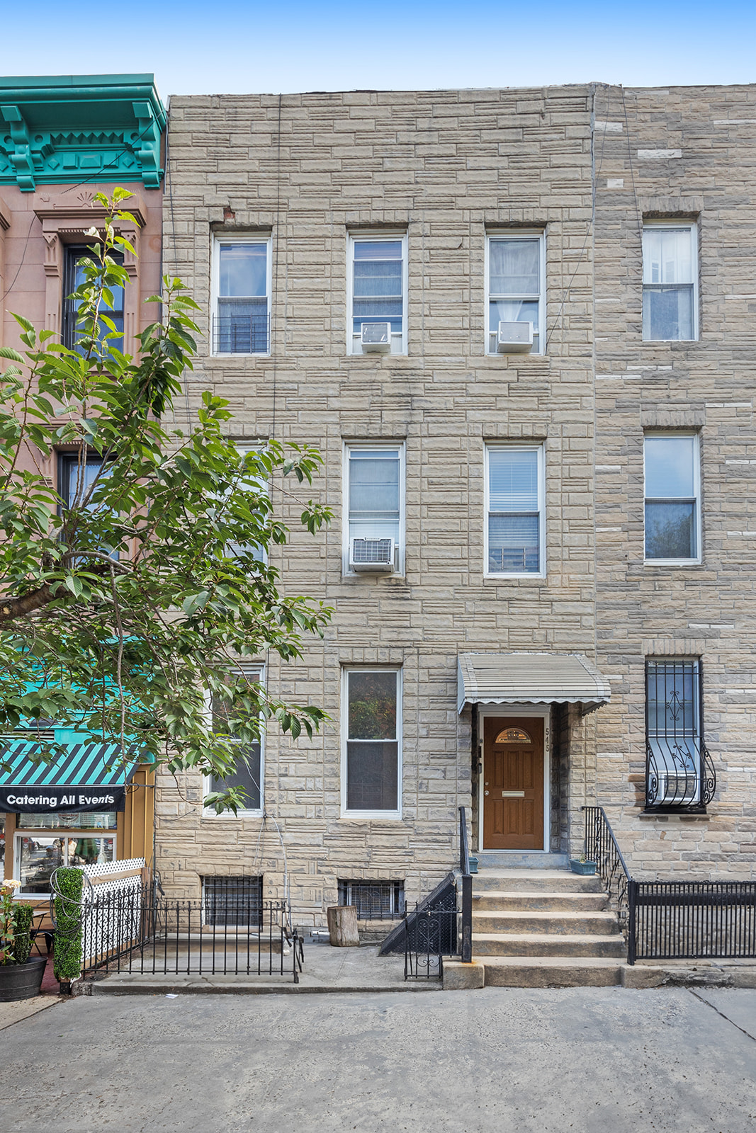 545 10th Street Brooklyn, NY 11215 - Photo 10 of 11 a front view of a brick house with a yard