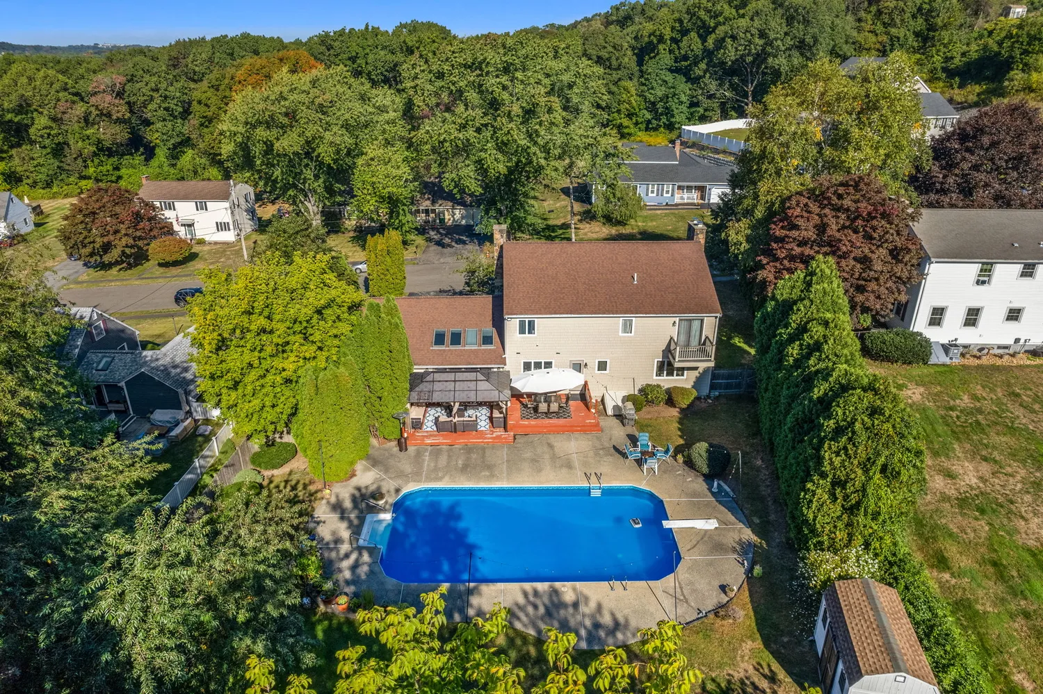 an aerial view of residential houses with outdoor space and street view