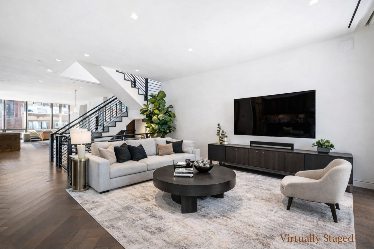 23 East 22nd Street, Unit TH2 Manhattan, NY 10010 - Photo 2 of 26 a living room with furniture and a flat screen tv