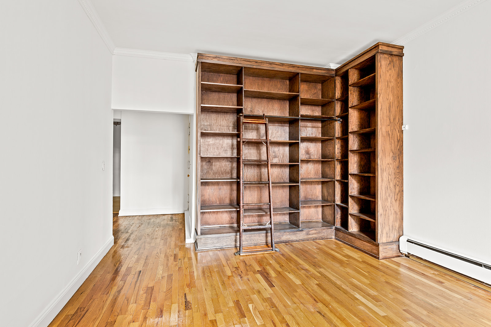 689 Fort Washington Avenue, Unit 1AA Manhattan, NY 10040 - Photo 8 of 13 a view of empty room with wooden floor and closet