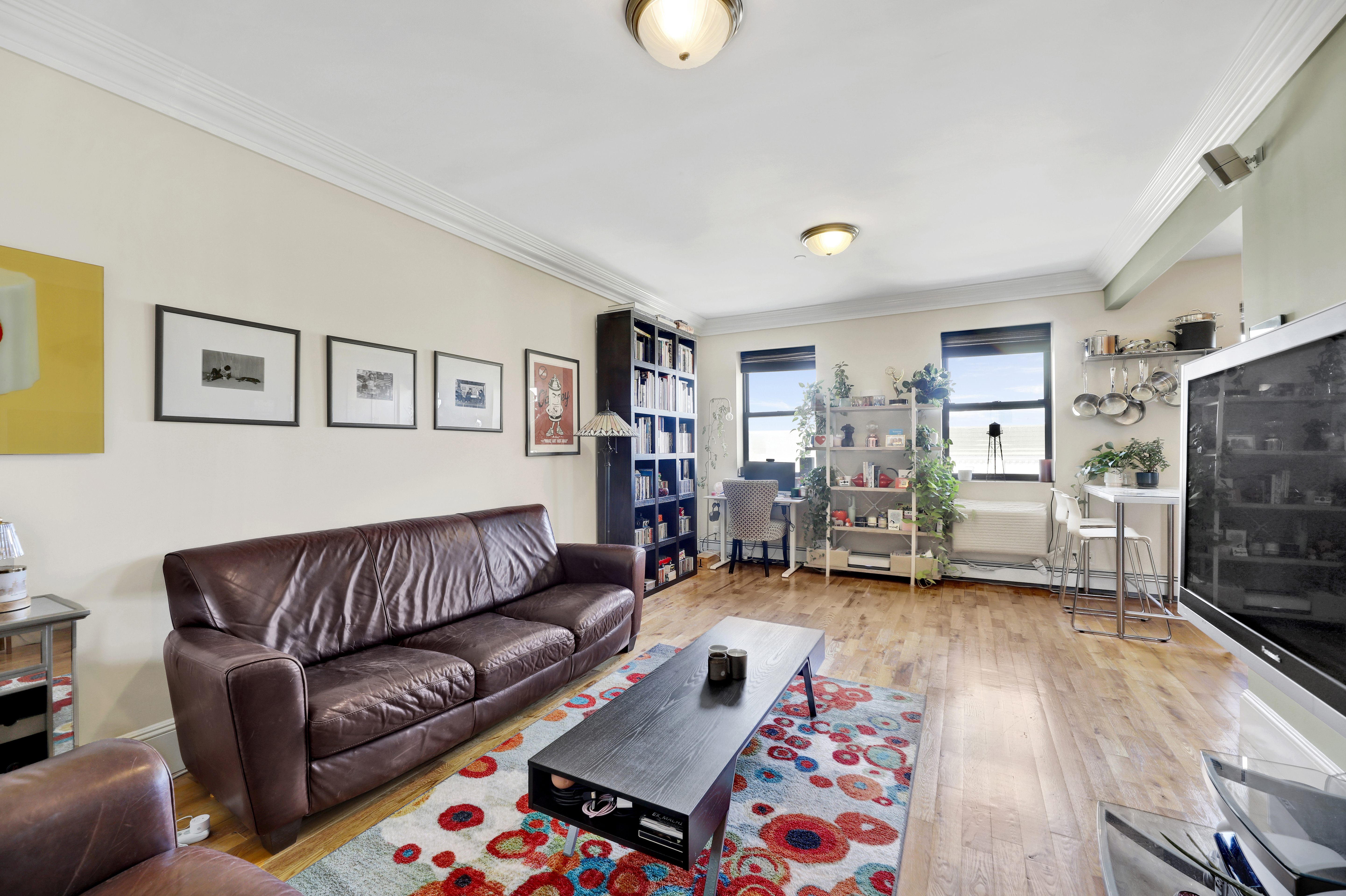 36 Russell Street, Unit 22 Brooklyn, NY 11222 - Photo 16 of 27 a living room with furniture and a flat screen tv